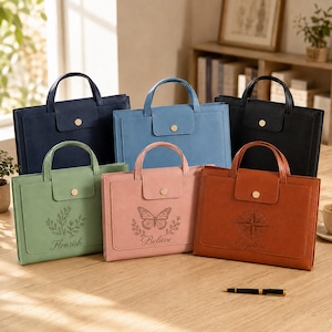 May include: Six rectangular document bags with top handles and gold-tone snap closures. Colors include navy, light blue, black, sage green, dusty pink, and tan. The green bag features a plant design, the pink has a butterfly, and the tan has a compass.