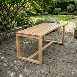May include: A rectangular wooden outdoor table with a slatted top and a geometric base. The table is made of light-colored wood and is set on a stone patio. The table measures approximately 72 inches long.