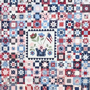 May include: A patchwork quilt in shades of red, white, and blue, featuring star and square patterns. The center square showcases a floral arrangement with an American flag. The quilt is a mix of floral and geometric designs.