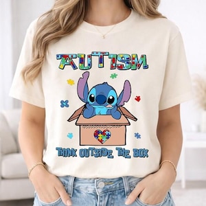 Camiseta "Think Autism Think Outside The Box", camiseta "Stitch Autism Month" de Disneyland, camiseta "Lilo & Stitch Autism Concientization", camiseta "Stitch Inclusion" imagen 1