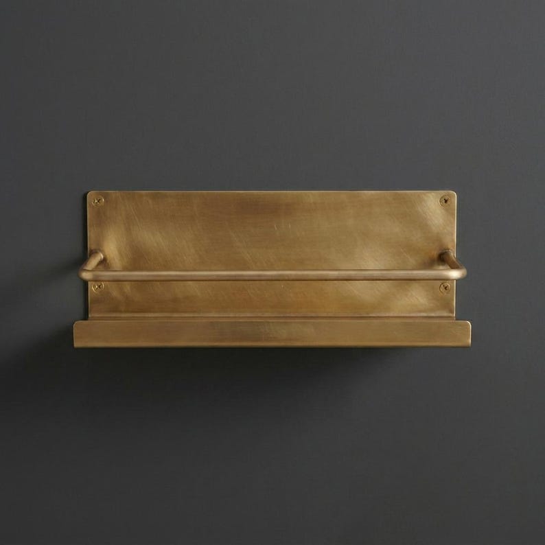 Brass Wall Shelf

Floating Brass Ledge

Gold Bathroom Shelf

Gallery Rail Shelf

Solid Brass Decor

Luxury Spice Rack

Mid Century Modern

Industrial Shelving

Apothecary Shelf

Handcrafted Brass

Entryway Organizer

Metal Floating Shelf

Unlacquered Brass