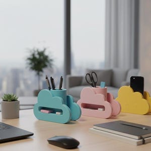 May include: Three cloud-shaped desk organizers in blue, pink, and yellow. The organizers hold pens, scissors, and a smartphone. A laptop, mouse, and succulent plant are also on the wooden desk. The background includes a window with a city view.