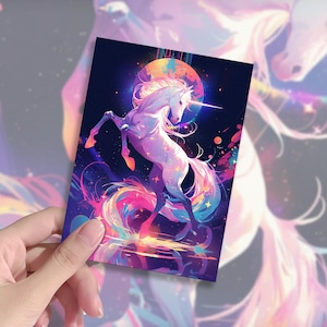May include: A vibrant illustration of a unicorn rearing up, set against a dark blue background with a glowing moon. The unicorn is white with a rainbow mane and tail. The artwork has a fantasy theme with colorful, cosmic elements.