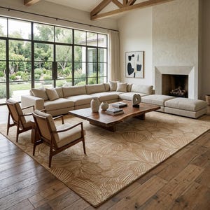 May include: A large beige sectional sofa with matching cushions, two wooden armchairs with beige upholstery, and a low rectangular live-edge wooden coffee table. A large area rug features a tan and white fan-shaped leaf pattern on the floor.