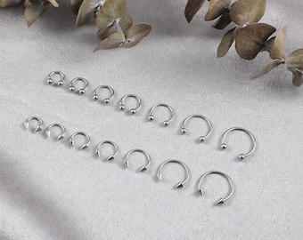 14 pièces anneaux de septum en fer à cheval en acier chirurgical 16G ensemble de bijoux de piercing pour les sourcils et les lèvres unisexe
