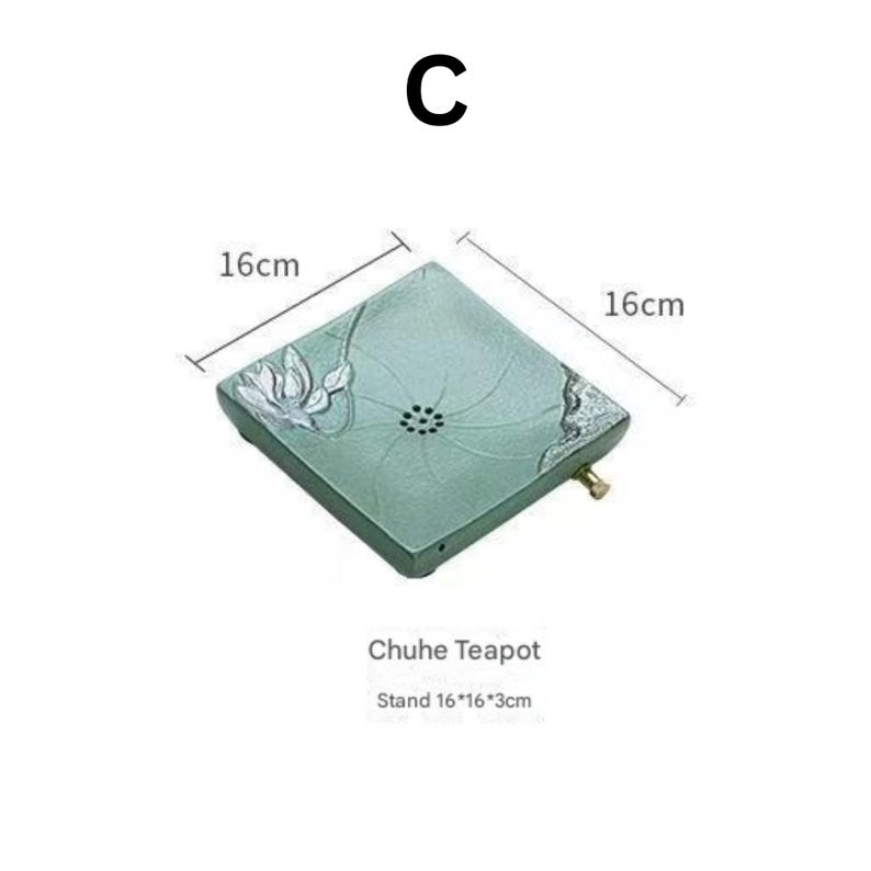 May include: A square, light green Chuhe teapot stand with a floral design and a small brass handle. The stand measures 16cm x 16cm x 3cm.