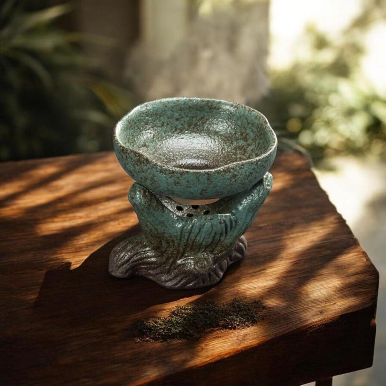May include: A set of three ceramic mugs with a speckled, matte finish. The mugs are in shades of cream, light brown, and dark brown. Each mug has a simple, minimalist design, perfect for coffee or tea.
