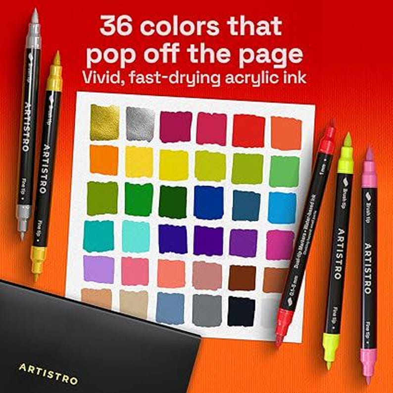 May include: A set of Artistro dual-tip acrylic markers with a color swatch chart displaying 36 distinct squares of color. The markers feature black barrels with white text, including fine and brush tips. Text reads: 36 colors that pop off the page.