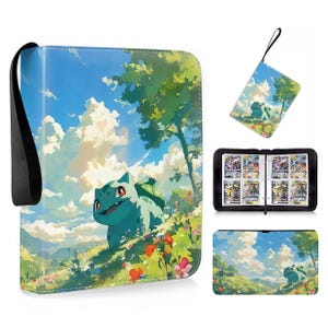 May include: A rectangular trading card binder featuring a light blue and green creature with a bulb on its back, set against a vibrant landscape of rolling hills, trees, and a bright blue sky with white clouds. Includes a black wrist strap.