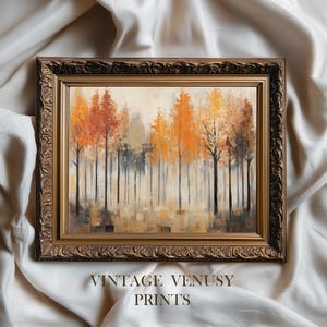 May include: An autumn-themed framed print featuring a forest of trees with orange, yellow, and brown foliage. The artwork is set in a gold-colored ornate frame. The text "VINTAGE VENUSY PRINTS" is printed at the bottom of the image.