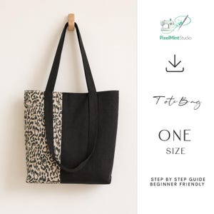 May include: A tote bag featuring a split design with one side in a black and tan leopard print and the other side in solid black. The bag has two long black shoulder straps. Text includes PixelMintStudio, Tote Bag, ONE SIZE, and STEP BY STEP GUIDE BEGINNER FRIENDLY.