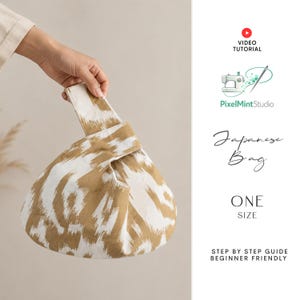 May include: A knot bag featuring a tan and white ikat pattern. The text on the right reads: VIDEO TUTORIAL, PixelMintStudio, Japanese Bag, ONE SIZE, STEP BY STEP GUIDE BEGINNER FRIENDLY. The bag has a single handle loop design for carrying.
