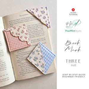 May include: Three fabric corner bookmarks with scalloped edges placed on an open book. One features a purple floral print, another a pink gingham and floral pattern, and the third a blue gingham and floral design. Text includes PixelMintStudio.