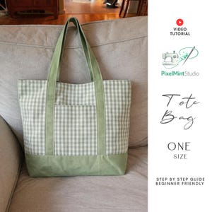 Może przedstawiać: Zielono-biała torba typu tote w kratę z zielonymi uchwytami i zielonym dolnym panelem. Torba ma kieszeń z przodu. Widoczny jest tekst "Tote Bag" i "One Size".