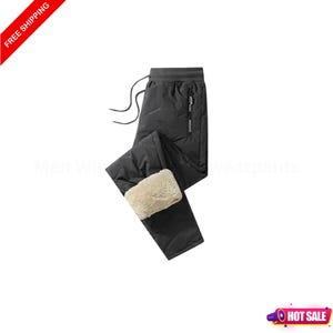 May include: Black insulated sweatpants with a drawstring waist and a zippered pocket. The bottom cuffs are lined with a beige, fuzzy material. The words "FREE SHIPPING" are in a red banner in the upper left corner.