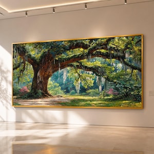May include: A large rectangular landscape painting in a gold frame depicting a massive oak tree with sprawling branches covered in hanging Spanish moss. The scene features vibrant green foliage, patches of sunlight, and pink flowers in a forest.