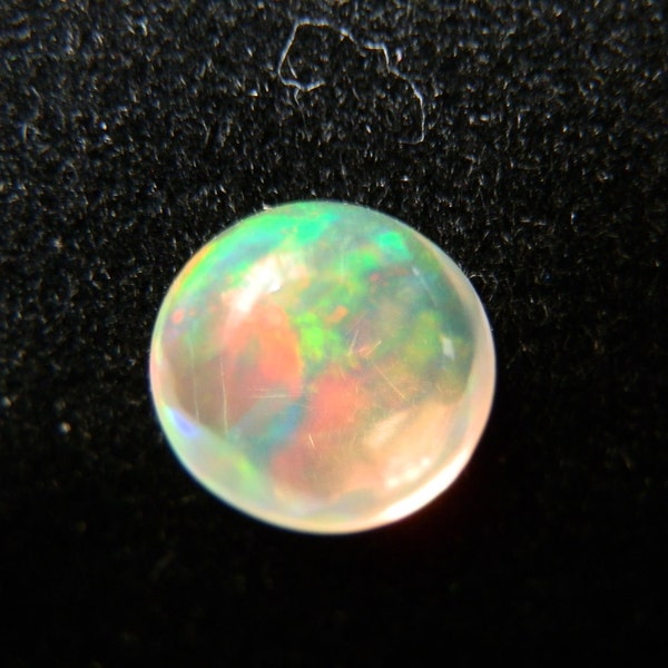 Fine Color Flash Mexican Opal Polished Loose 7mm Cabochon. 1.07cts.