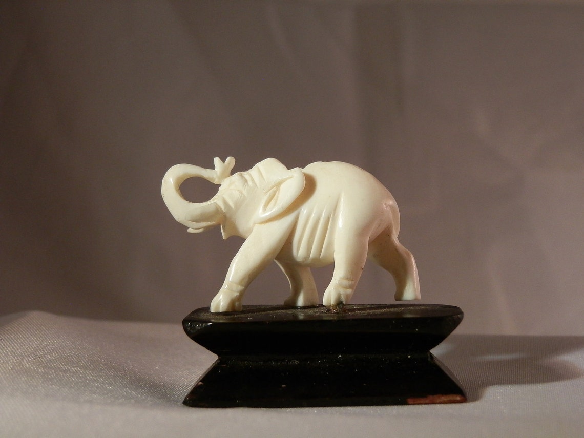 Pre Ban Ivory elephant carving on attached stand. 39x32x12mm Etsy