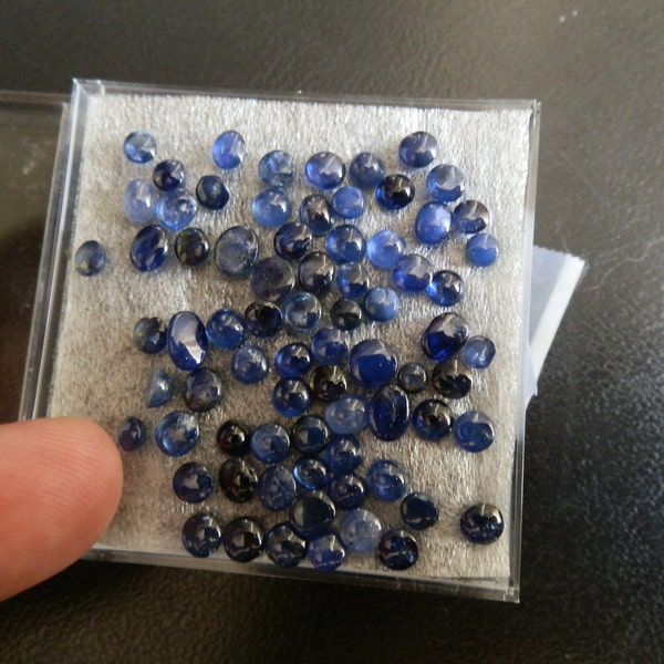 Blue Sapphire cabs. About 75 total. Nice colors. Real sapphire. FREE SHIPPING.