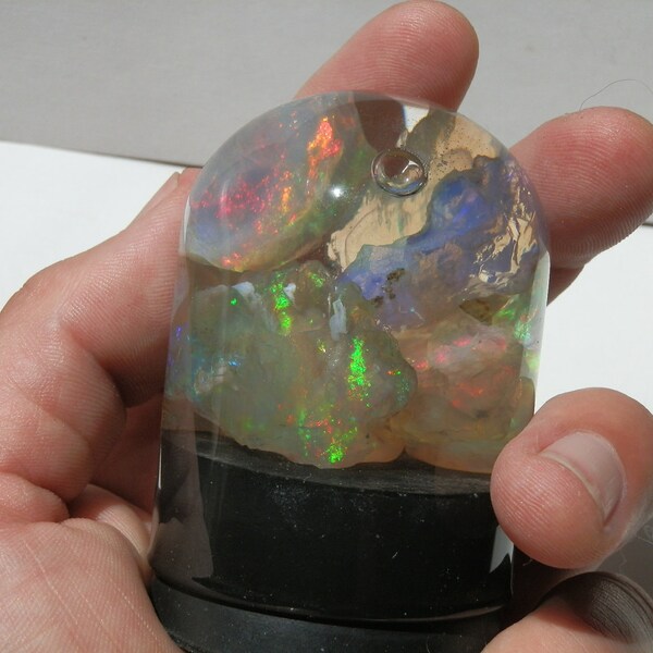 Virgin Valley Opals. Amazing color play. Display pieces in glass dome. High quality. Phantoms. All colors.