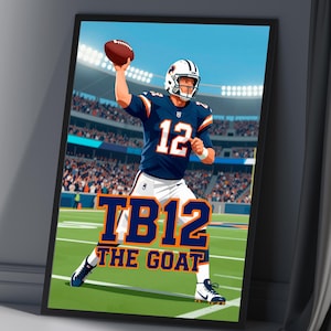May include: Framed artwork featuring a football player in a blue and white uniform throwing a football. The artwork includes the text "TB12 THE GOAT" in orange and white. The background depicts a stadium with a green field.