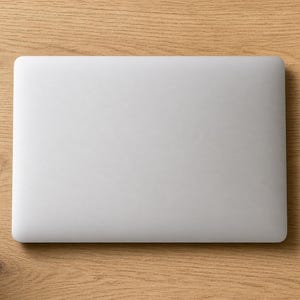 May include: A closed silver laptop sits next to a white rectangular sticker sheet featuring the text Human in the loop, --dangerously-skip-permissions, Accept All Changes, PLS FIX, FOREST MAXIMIZE, VIBE CODER, and various colorful graphic icons.