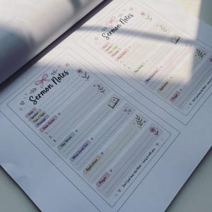 May include: A white paper sheet featuring two identical printed sermon note templates. Each template includes the header Sermon Notes, a pink bow illustration, floral accents, and sections for date, speaker, topic, passage, main points, key verses, application, and prayer. The text Don't just hear the Word&mdash;carry it with you is printed at the bottom.