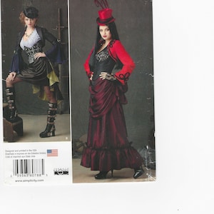 May include: Simplicity Costumes pattern featuring two women in steampunk-inspired outfits. One wears a black and red ensemble with a top hat, the other a black and brown outfit with a hat and boots. The pattern includes sizes 14-22.