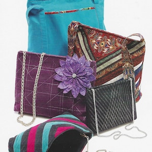 May include: A collection of five bags including a large solid teal tote, a patterned shoulder bag with floral motifs, a purple quilted clutch with a large fabric flower, a small black quilted bag, and a striped pouch, all featuring silver chains.