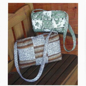 May include: Two boxy patchwork bags with shoulder straps. One bag features a green and white floral pattern, while the other displays a brown and white animal print. The text reads: Kq105, Rotary Cut Border Bag, Boxy Patchwork Bag, JM Photography, The Kentucky Quilt Company, 1523 Coles Bend Road, Smiths Grove, KY 42171, ajbenham@scrtc.com.
