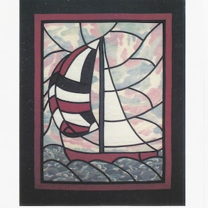 May include: A framed artwork featuring a sailboat with a red hull and sail, black and white striped sail, and a mast. The artwork is labeled "Spinnaker" at the top and "Mace Motif" at the bottom.