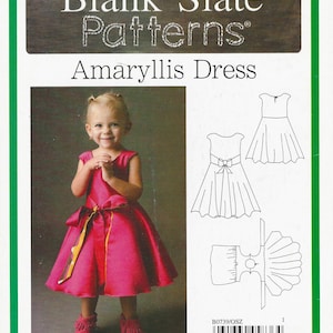 May include: A sewing pattern envelope for the Blank Slate Patterns Amaryllis Dress, model F739, for sizes 18 months to 8. The cover features a photograph of a child in a bright pink dress with a bow and line drawings of the dress design.