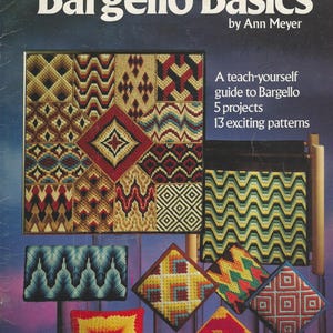 Op de afbeelding: De omslag van het boek "Bargello Basics" van Ann Meyer, met verschillende Bargello-naaldkunstpatronen in diverse kleuren. De afbeelding bevat een ingelijste weergave van verschillende ontwerpen en verschillende voltooide projecten.