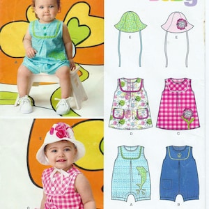 May include: A New Look sewing pattern for baby clothes. The image shows a baby wearing a blue romper and a pink and white gingham dress. The pattern includes various designs for dresses, rompers, and hats. The text "Baby" is visible.