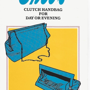 May include: A product illustration for Ghee's Clutch Handbag for Day or Evening #701. The image displays two blue quilted clutch handbags with thin chain straps, one shown closed and one shown open, set against a yellow rectangular background.