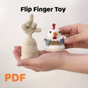 May include: Crocheted "Flip Finger Toy" featuring a middle finger and a chicken figure. The middle finger is beige, and the chicken is white with red, orange, and blue accents. The text "Flip Finger Toy" and "PDF" are visible.