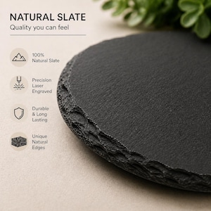 May include: A round, natural slate serving board with unique, rough edges. The dark gray surface has a textured appearance. Text on the image reads "NATURAL SLATE" and "Quality you can feel". Additional text describes the slate as "100% Natural Slate", "Precision Laser Engraved", and "Durable & Long Lasting".