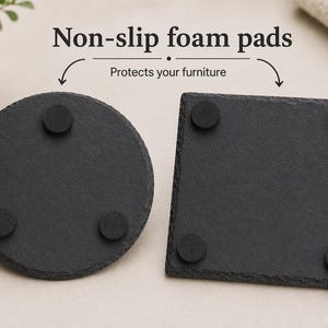 May include: Two black slate coasters, one round and one square, each with four non-slip foam pads. The text "Non-slip foam pads" and "Protects your furniture" are displayed above the coasters.