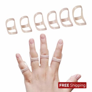 May include: A hand wearing beige finger splints. Six additional splints are arranged above the hand. The splints are made of a flexible material and are designed to support the fingers. The image has a white background.