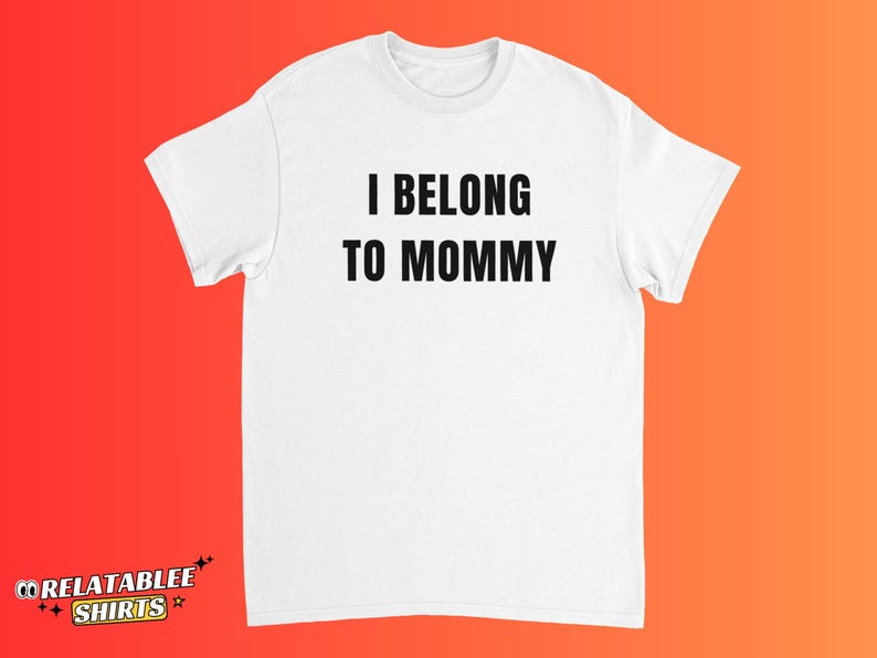 May include: White t-shirt with the text "I BELONG TO MOMMY" in bold, black capital letters. The shirt has short sleeves and a crew neck. The brand logo "RELATABLEE SHIRTS" is at the bottom left.