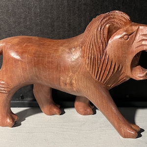 Vintage Hand Carved Lion made out of Wood.