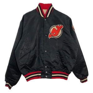 May include: A set of three ceramic mugs with a speckled, matte finish. The mugs are in shades of cream, light gray, and dark gray. Each mug has a simple, minimalist design, perfect for coffee or tea.