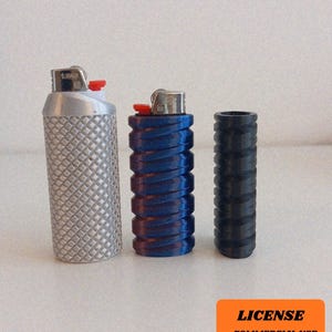 May include: Three lighter cases in silver, blue, and black. The silver case has a diamond pattern, the blue case has a spiral design, and the black case has a ribbed texture. The lighters are visible at the top of the cases.