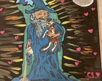 May include: A painting of a wizard in a blue robe holding a small animal. The wizard is surrounded by pink hearts and yellow and orange streaks of light. The background is black with a white moon.