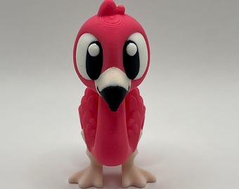 Estatueta de flamingo rosa impressa em 3D para decoração de mesa.