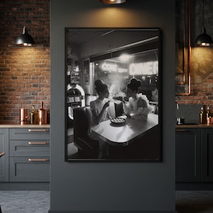 Retro 50s cafe women framed poster hanging in dramatic dark modern kitchen with exposed brick pendant lights copper accents and industrial design aesthetic