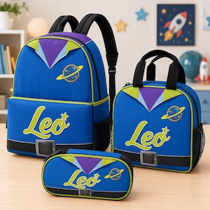 May include: A blue backpack, lunch bag, and pencil case set featuring a space-themed design with purple and lime green accents. Each item displays the name Leo in lime green script, a yellow planet graphic, and a black belt detail with a buckle.