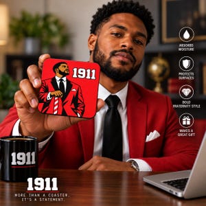 May include: A square coaster featuring a graphic illustration of a person in a red suit and black tie with the text 1911. The coaster has a red background and black border. The design includes a red and white striped cane held by the figure.