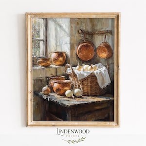 May include: A framed print of a kitchen scene with copper pots and pans, a basket of onions, and a wooden table. The artwork has a warm, rustic aesthetic, with soft lighting and a vintage feel. The print is from Lindenwood Prints.