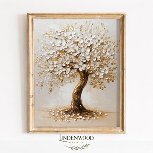 Op de afbeelding: Een ingelijst schilderij van een boom met witte en gouden bloesems. De boomstam is bruin en de achtergrond is een neutraal beige. De lijst is goudkleurig en het schilderij heeft een textuur, driedimensionale uitstraling. De tekst "LINDENWOOD PRINTS" staat onderaan.